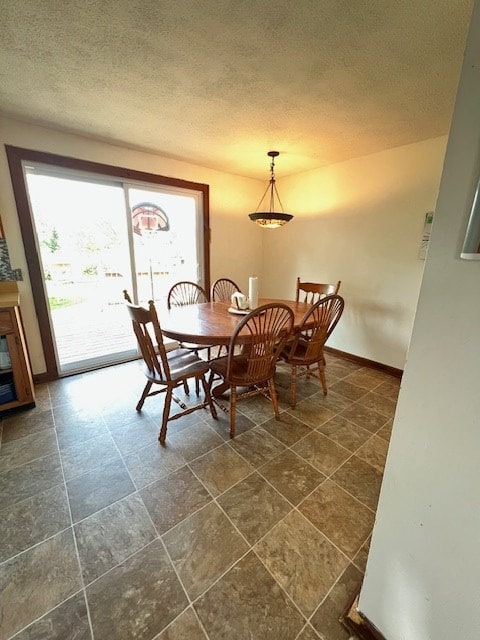 2415 State Route 96, Ashland, OH 44805 - dining area featuring a textured ceiling and baseboards