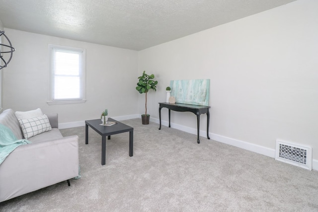 1008 Burger Ave, Mansfield, OH 44906 - carpeted living room featuring baseboards and a textured ceiling