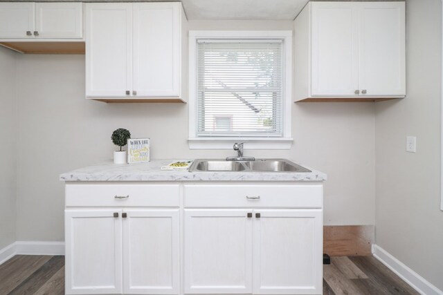 1008 Burger Ave, Mansfield, OH 44906 - kitchen with a sink, baseboards, and dark wood finished floors