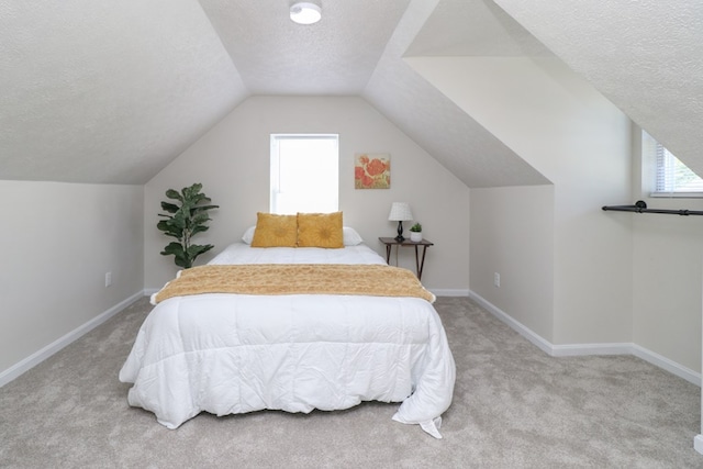 1008 Burger Ave, Mansfield, OH 44906 - bedroom featuring carpet, a textured ceiling, lofted ceiling, and baseboards