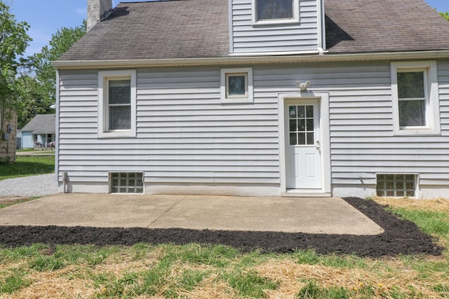1008 Burger Ave, Mansfield, OH 44906 - rear view of property with a patio, a chimney, and a shingled roof
