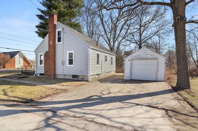 view of property exterior featuring a detached garage, concrete driveway, an outdoor structure, a shingled roof, and a chimney