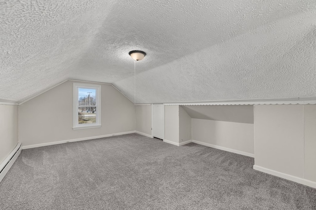 bonus room featuring baseboards, a baseboard radiator, vaulted ceiling, a textured ceiling, and carpet flooring