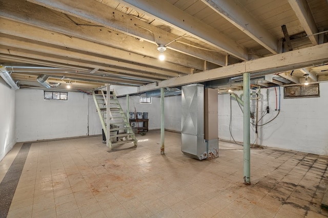 below grade area with tile patterned floors and heating unit