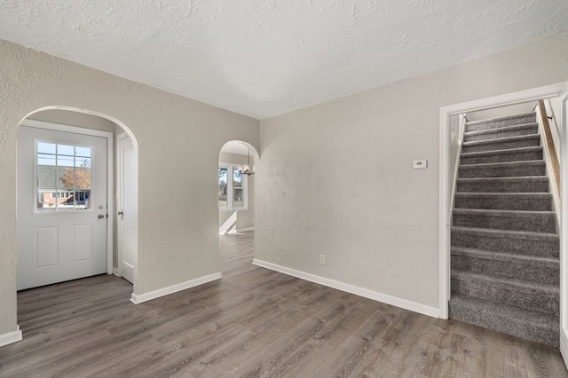 entryway with a wealth of natural light and a textured wall
