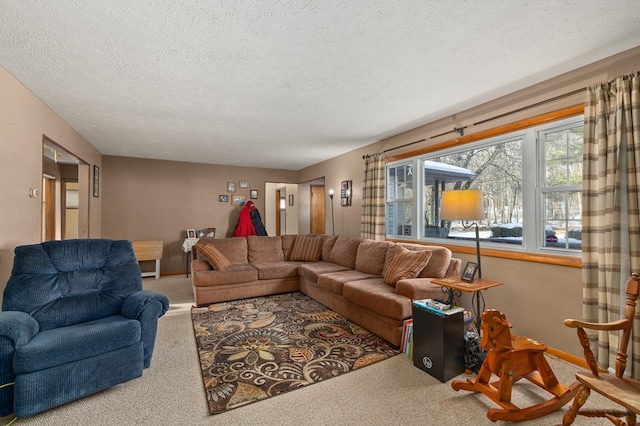 carpeted living room featuring a textured ceiling