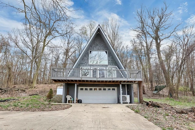 view of property exterior featuring a wooden deck, driveway, ac unit, and an attached garage