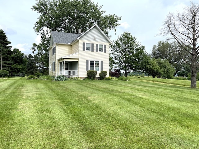 5655 Lime Rd, Galion, OH 44833 - view of front facade featuring a front lawn and covered porch