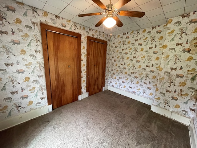 5655 Lime Rd, Galion, OH 44833 - unfurnished bedroom with two closets, carpet, wallpapered walls, and ceiling fan