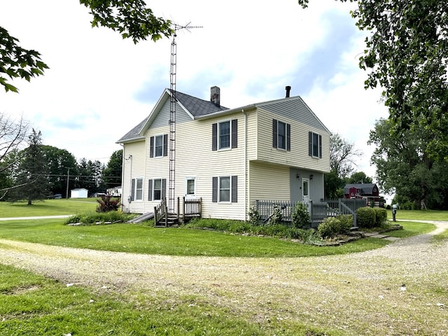 5655 Lime Rd, Galion, OH 44833 - view of property exterior featuring a chimney and a yard