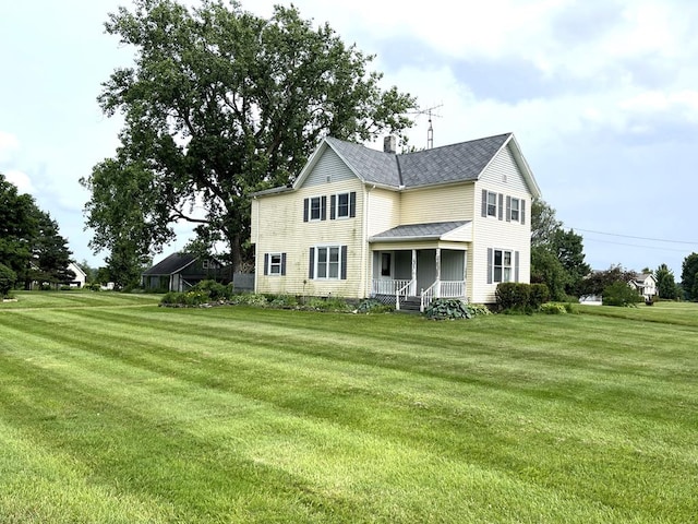 5655 Lime Rd, Galion, OH 44833 - rear view of house with a lawn, a chimney, and a porch