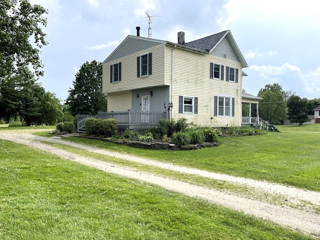 5655 Lime Rd, Galion, OH 44833 - view of front of home with a chimney, driveway, and a front yard
