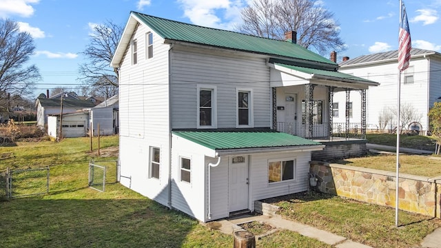 view of front of property with a porch and a front yard