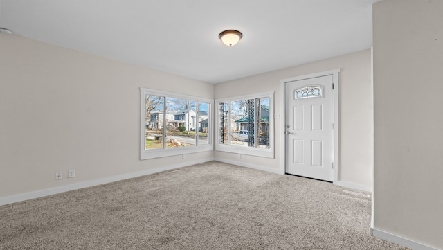 view of carpeted foyer