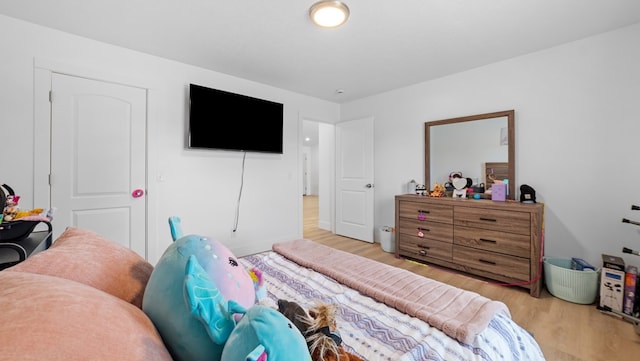 bedroom with wood finished floors