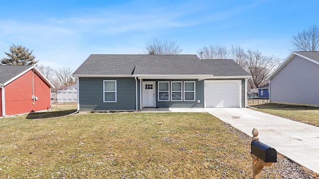 view of front facade with driveway, a front lawn, roof with shingles, and an attached garage