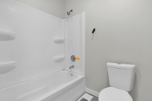 bathroom with shower / bathtub combination and toilet