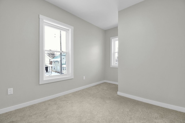 spare room with light carpet