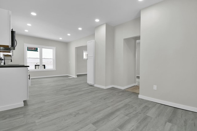 unfurnished living room with light hardwood / wood-style floors