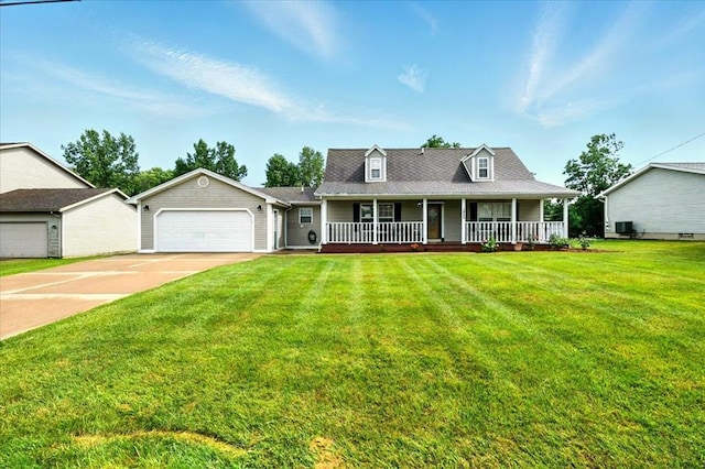 1645 Spring Village Ln, Mansfield, OH 44906 - view of front of house with a porch, driveway, a front yard, and an attached garage