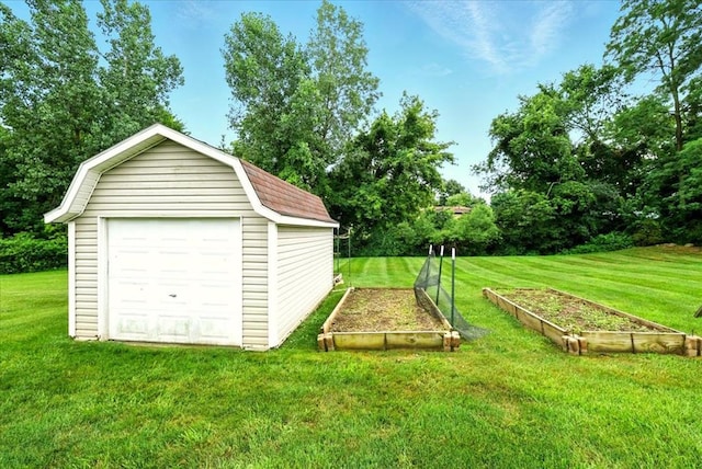 1645 Spring Village Ln, Mansfield, OH 44906 - garage with a garden and view of scattered trees