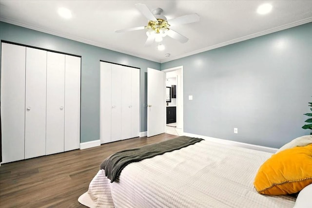 1645 Spring Village Ln, Mansfield, OH 44906 - bedroom with two closets, wood finished floors, recessed lighting, ornamental molding, and a ceiling fan