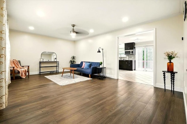 1645 Spring Village Ln, Mansfield, OH 44906 - living room featuring ceiling fan, dark wood-style flooring, recessed lighting, and ornamental molding