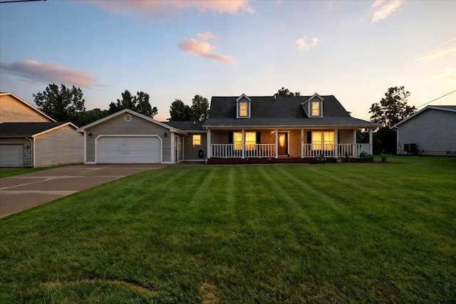 1645 Spring Village Ln, Mansfield, OH 44906 - view of front of property featuring a porch, driveway, a yard, and a garage