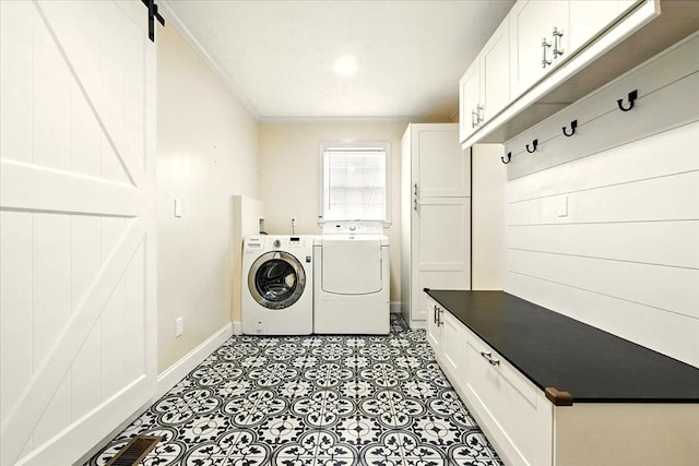 1645 Spring Village Ln, Mansfield, OH 44906 - washroom with separate washer and dryer, cabinet space, ornamental molding, and light flooring