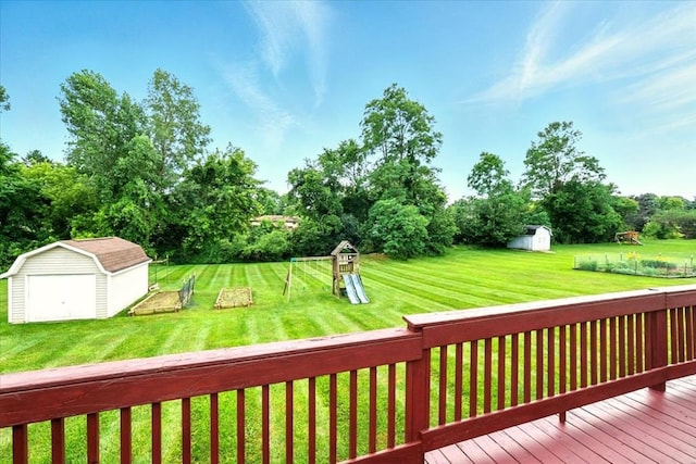 1645 Spring Village Ln, Mansfield, OH 44906 - wooden deck featuring a storage shed, a yard, and view of wooded area