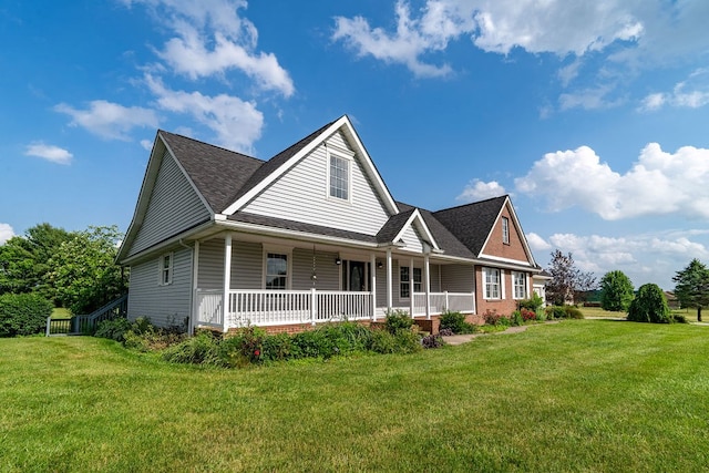 4299 County Road 20, Mount Gilead, OH 43338 - view of front of home with a porch, a front yard, and a shingled roof