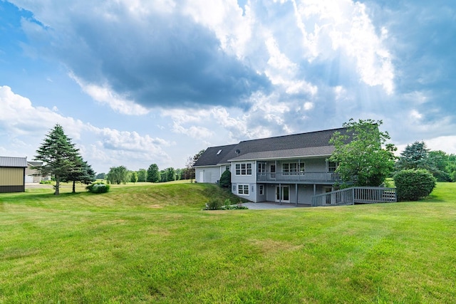 4299 County Road 20, Mount Gilead, OH 43338 - rear view of property featuring a yard, a wooden deck, a patio area, and a garage