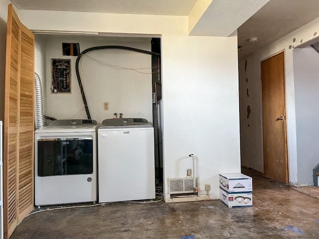 laundry room featuring laundry area and washing machine and clothes dryer