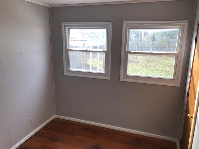 spare room featuring dark hardwood / wood-style floors