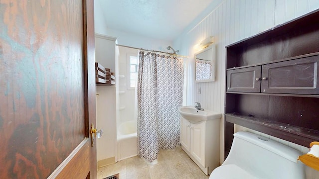 bathroom with toilet, shower / bathtub combination with curtain, vanity, and tile patterned floors