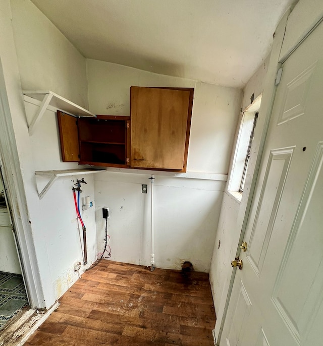 clothes washing area featuring laundry area, wood finished floors, and hookup for a washing machine