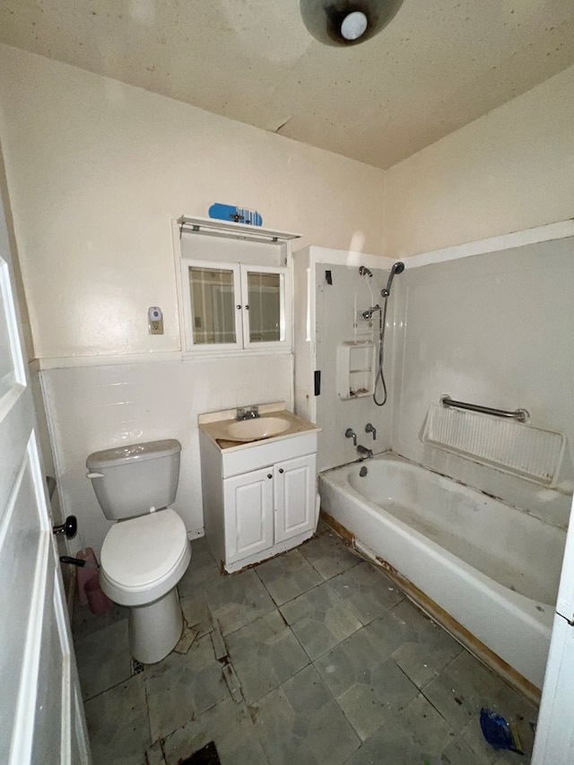 full bathroom featuring tub / shower combination, vanity, and toilet