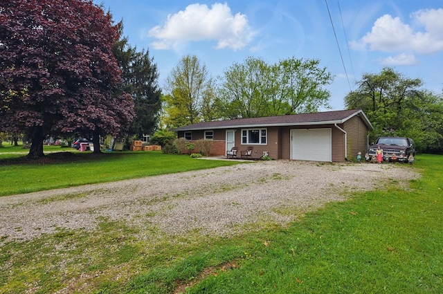 ranch-style home featuring an attached garage, driveway, and a front lawn