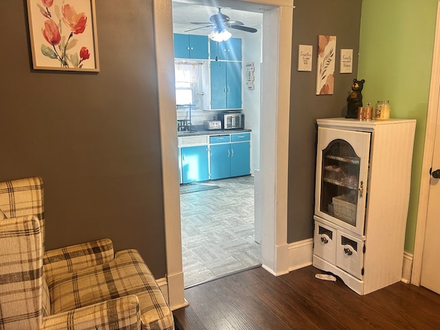 hallway with sink and dark wood-type flooring