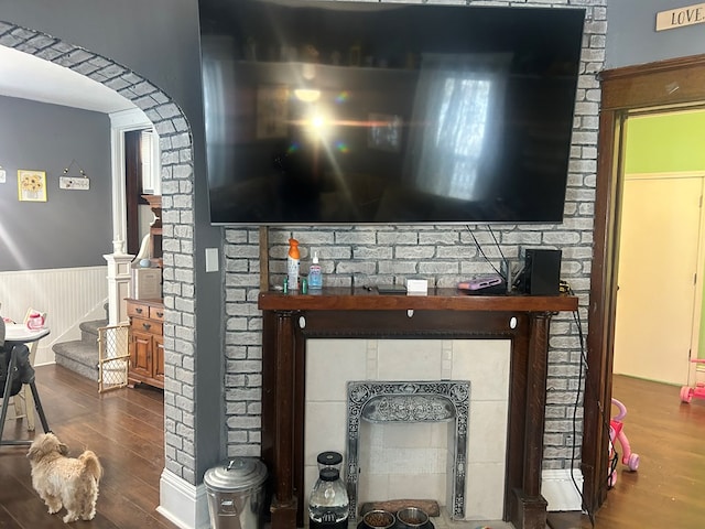 room details with hardwood / wood-style floors and a fireplace