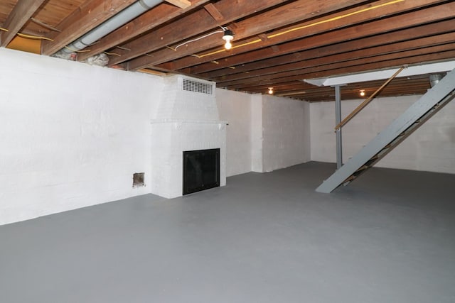 basement with a fireplace