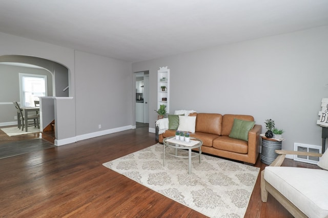 living room with dark wood-type flooring