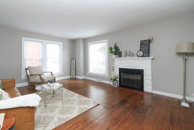 living room with dark hardwood / wood-style flooring