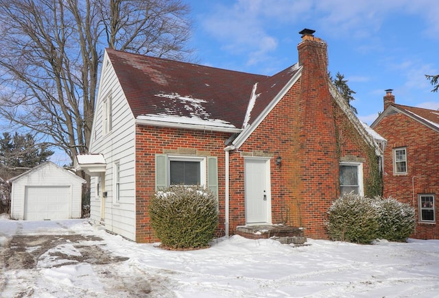 view of front facade with an outbuilding and a garage