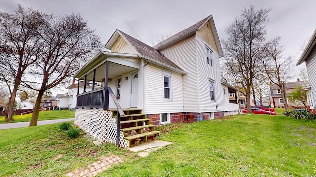 view of home's exterior featuring a residential view and a yard