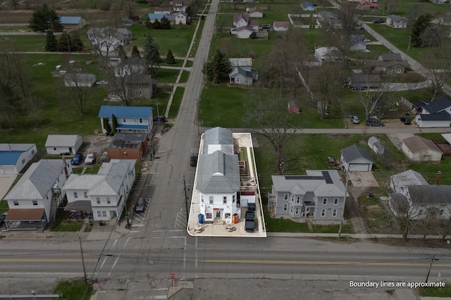 birds eye view of property with a residential view