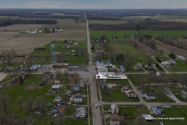 birds eye view of property with a rural view