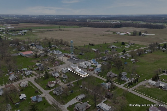 drone / aerial view featuring a residential view and a rural view