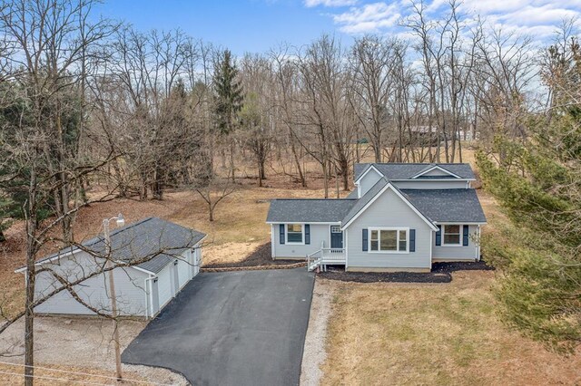 7326 State Route 19 Unit U3 L57-59, Mount Gilead, OH 43338 - view of front facade featuring a shingled roof, an outdoor structure, and asphalt driveway