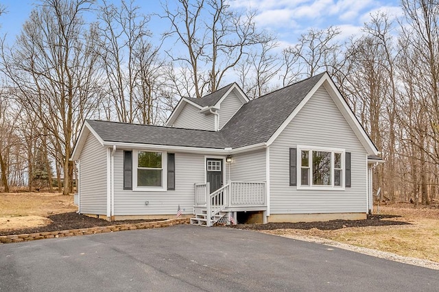 view of front of property with a shingled roof